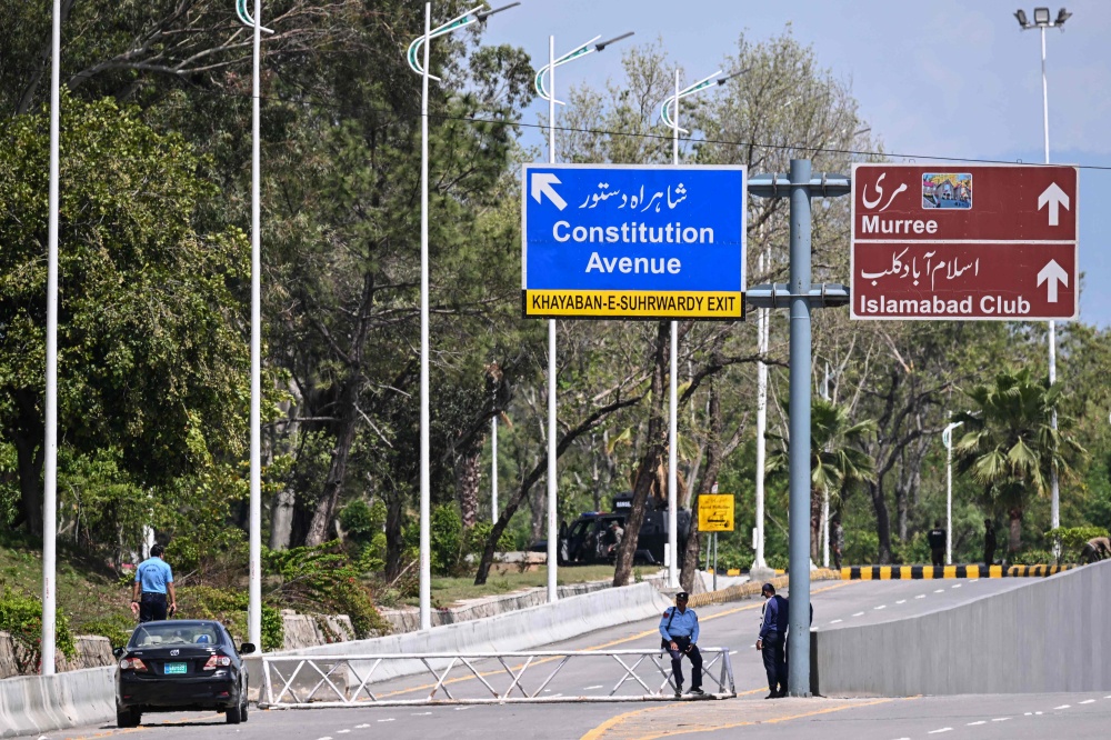 Security personnel keep watch near the expected venue of the US-Iran talks in the Red Zone area of Islamabad on April 10, 2026. With Iran insisting that Israel cease fire on Lebanon ahead of talks in Pakistan, Trump told Israeli Prime Minister Benjamin Netanyahu in a phone call on Thursday to ‌lighten up attacks on Hezbollah, a source familiar with the matter said. — AFP pic