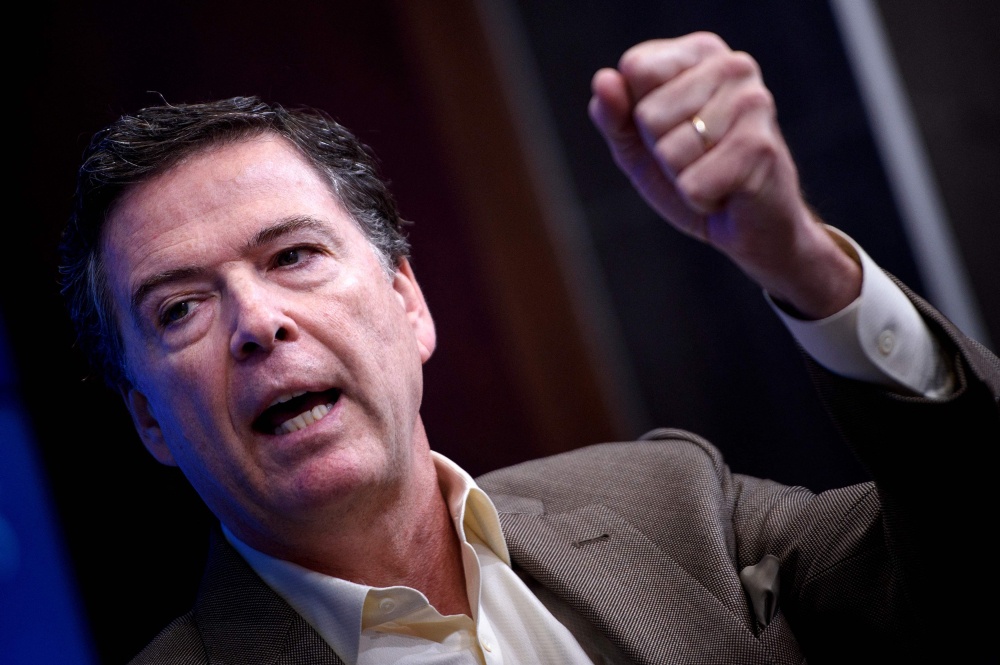 Former FBI Director James Comey speaks about his book ‘A Higher Loyalty’ during a discussion at the Brookings Institution in Washington on May 11, 2018. — AFP pic