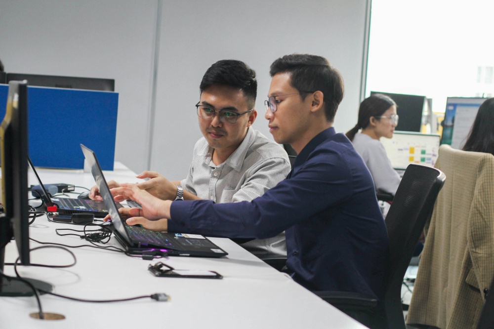 Employees collaborate in a modern workplace. As industries are reshaped by technology, economic volatility and changing job expectations, career resilience and continuous upskilling are emerging as the new pillars of Labour Day in 2026. — Unsplash pic