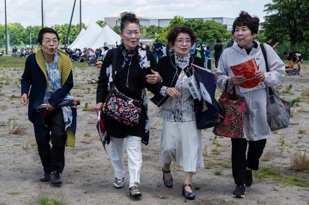 Curious spectators at the ICC T20 World Cup East Asia-Pacific Qualifier match between Japan and Vanuatu clutch rulebooks watch as a batsman smacks a six into the sand and weeds surrounding Japan’s brand-new cricket ground, four months before it hosts matches at the Asian Games. — AFP pic