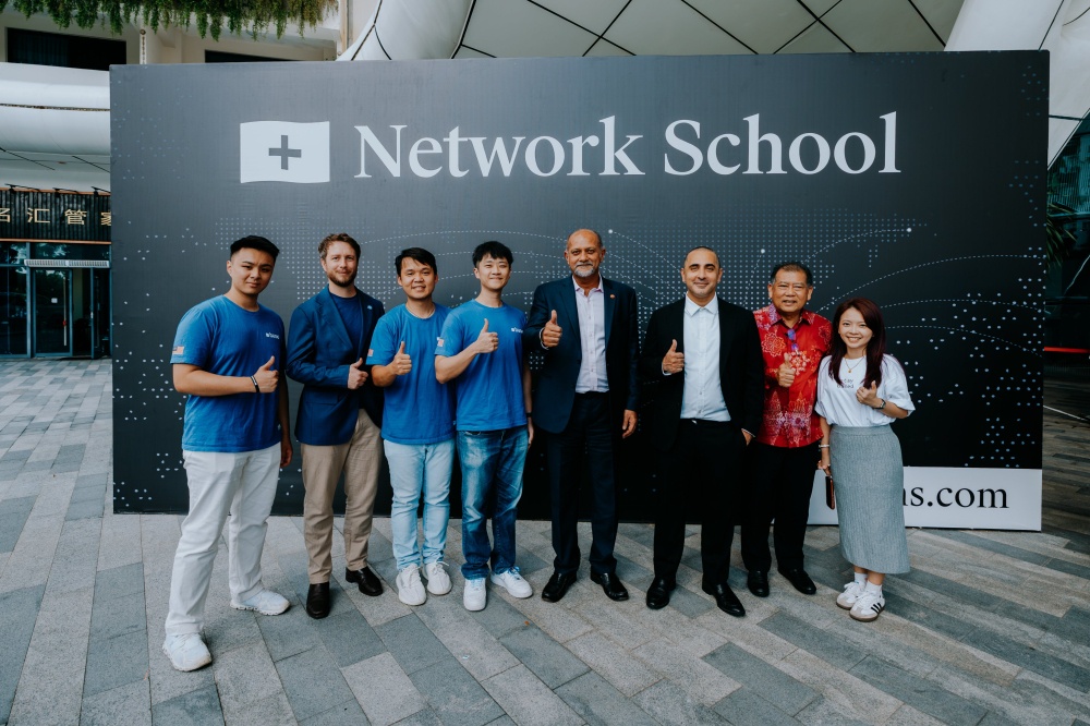 Digital Minister Gobind Singh Deo (fourth from right) and his deputy Datuk Wilson Ugak at Base Builder’s Loft, Network School in Forest City, Johor, with Balaji Srinivasan (third from right) and Base representatives posted on April 17, 2026. — Picture from X/Base APAC