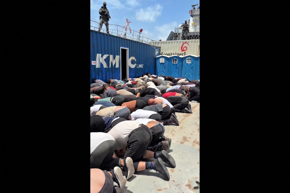 Screen grab from Israeli minister Itamar Ben Gvir’s X account on May 20, 2026 shows Gaza‑bound flotilla activists kneeling with hands tied on a military boat. — AFP pic/X account of Israel’s National Security Minister Itamar Ben Gvir
