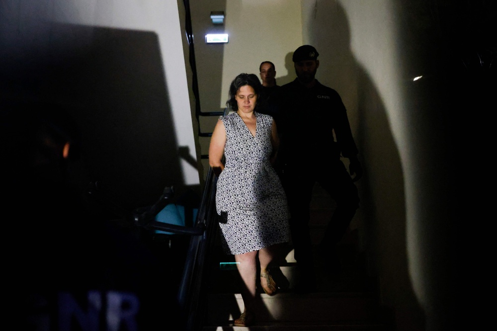 Frenchwoman Marine R. (left) leaves the Setubal courthouse, suspected of abandoning two children, in Setubal, Portugal May 23, 2026. — AFP pic 
