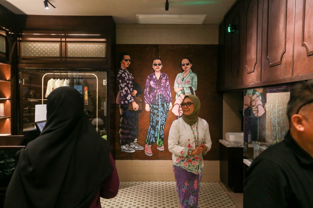 Visitors walk past a mural inside a store within the newly renovated Old General Post Office on Jalan Raja, Kuala Lumpur, May 23, 2026. — Picture by Sayuti Zainudin