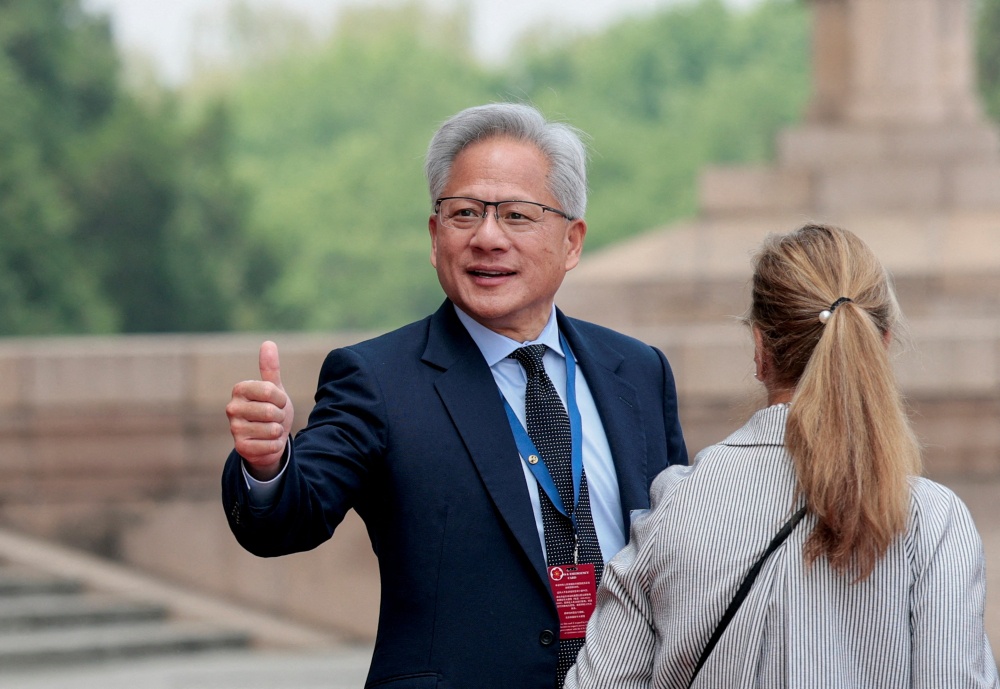 Jensen Huang, Founder, President and CEO of Nvidia gestures as he leaves after attending a welcome ceremony for US President Donald Trump with Chinese President Xi Jinping at the Great Hall of the People in Beijing May 14, 2026. — Reuters pic