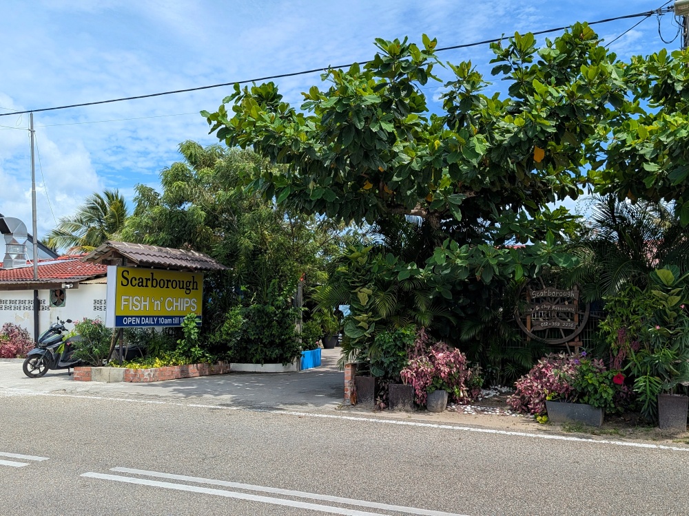 The sign as seen from the road, still standing after 16 years. — Picture by Ethan Lau