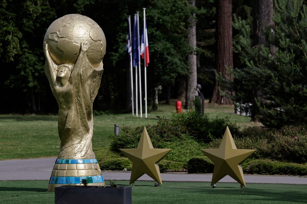 A replica of the Fifa World Cup Trophy stands at the entrance to the French football federation’s Clairefontaine training base, southwest of Paris. — AFP pic