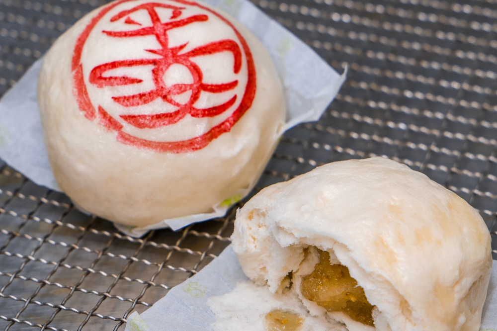 A bun stamped with the Chinese characters for peace and pronounced as ‘Ping On’ in Cantonese, and its traditional white sesame filling. In the past, it was stamped with the Chinese character 寿 pronounced in Cantonese as ‘Sau’ (longevity). — Picture courtesy of Hong Kong Tourism Board.