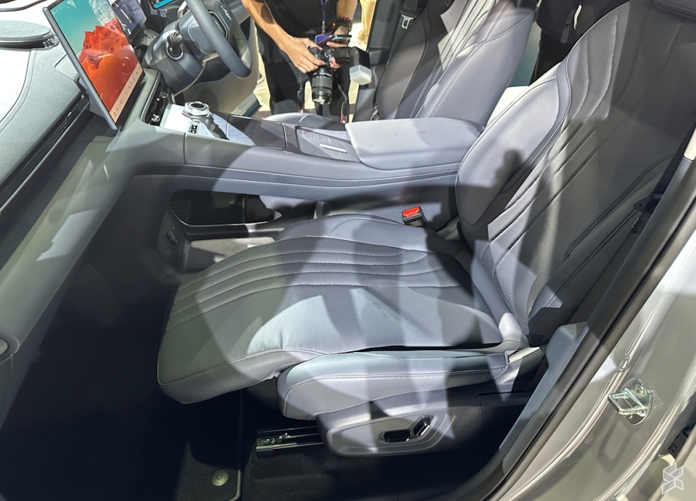 A reclinable front passenger seat with an extendable leg rest is among the Premium Plus variant's standout upgrades. — SoyaCincau pic