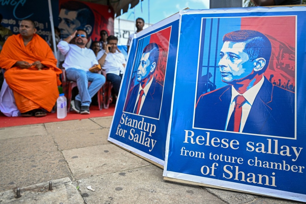 Sri Lanka’s opposition activists demanding the release of detained former intelligence chief Suresh Sallay take part in a sit-in protest outside the railway station in Colombo June 10, 2026. — AFP pic