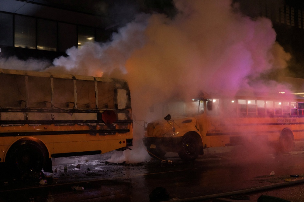 A fire on a shuttle bus, used to transport spectators for 2026 Fifa World Cup, is extinguished outside the Port Authority Bus Terminal in New York, amid celebrations over the New York Knicks’ win over the San Antonio Spurs and World Cup festivities, New York June 14, 2026. — Reuters pic