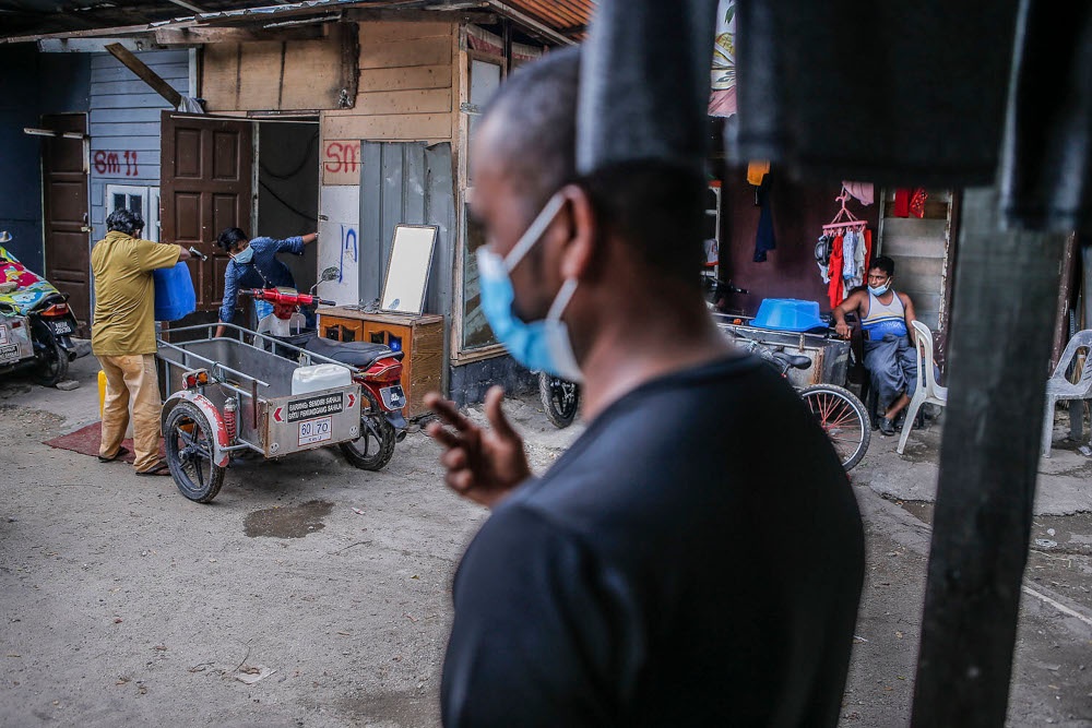 People are seen at a Rohingya settlement in Kuala Lumpur on June 13, 2021. — Picture by Hari Anggara