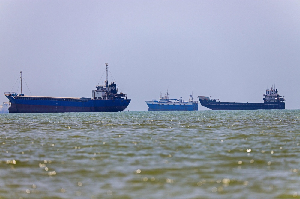Ships are seen anchored in Bandar Abbas along the Strait of Hormuz, a strategic waterway that carries about a fifth of the world's oil supplies and remains vulnerable to disruption amid tensions in West Asia, on June 18, 2026. — ISNA/AFP pic
