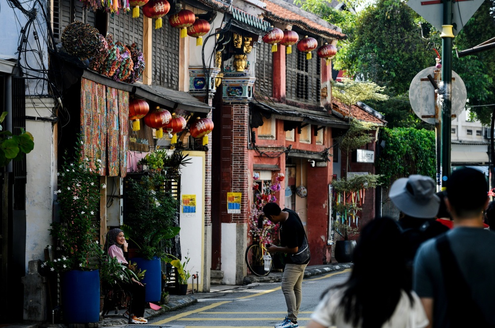 Tourists visit the UNESCO World Heritage Site at Armenian Street in George Town on July 7, 2026. — Bernama pic