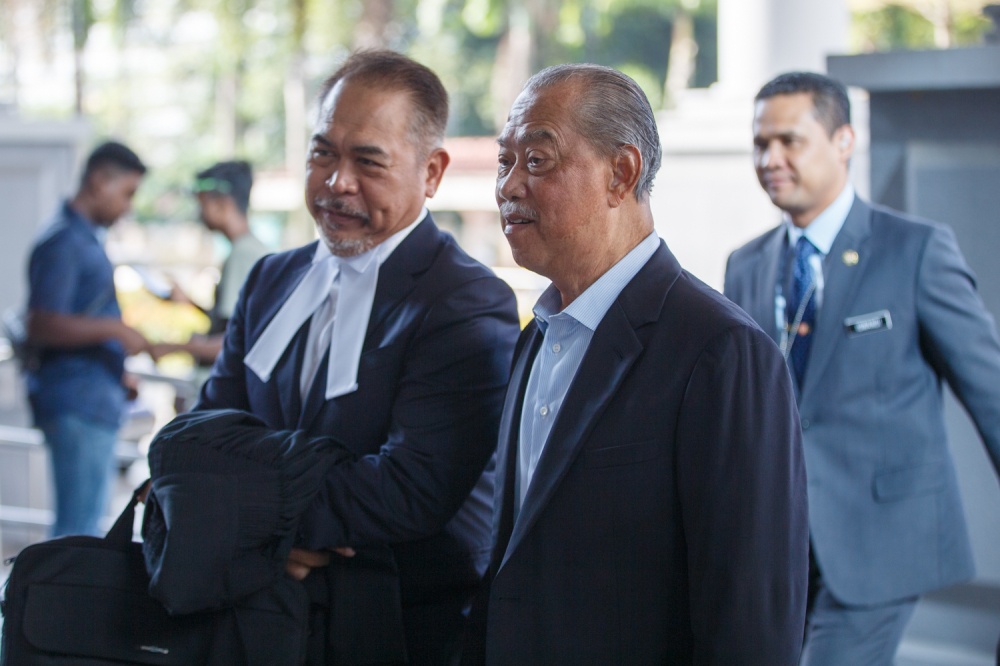 Former prime minister Tan Sri Muhyiddin Yassin arrives at the Kuala Lumpur High Court Complex for his ongoing trial July 7, 2026. — Picture by Raymond Manuel