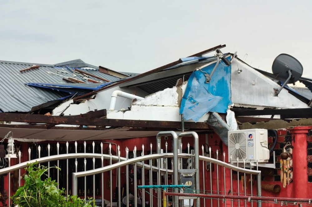Damages to the roof of a house in Sibu Jaya after strong winds on Saturday. — The Borneo Post pic