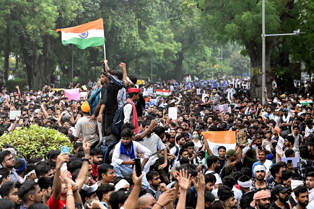 Cockroach Janta Party activists and supporters protest in New Delhi on July 20, 2026, demanding Education Minister Dharmendra Pradhan’s resignation over alleged NEET examination irregularities. — AFP pic