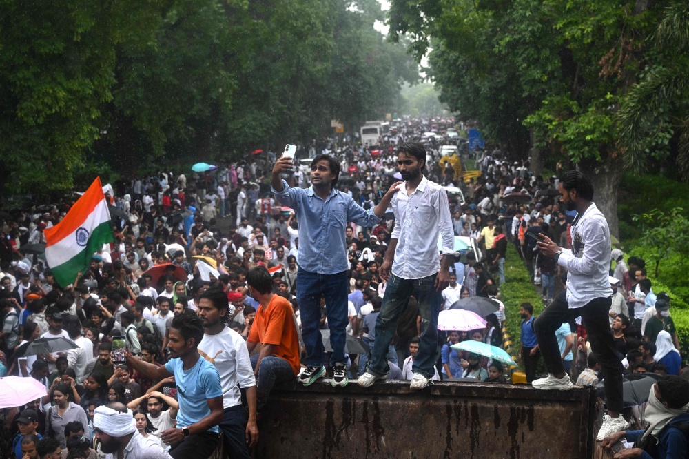 Cockroach Janta Party activists gather in New Delhi on July 20, 2026, to demand Education Minister Dharmendra Pradhan’s resignation over alleged examination irregularities. — AFP pic