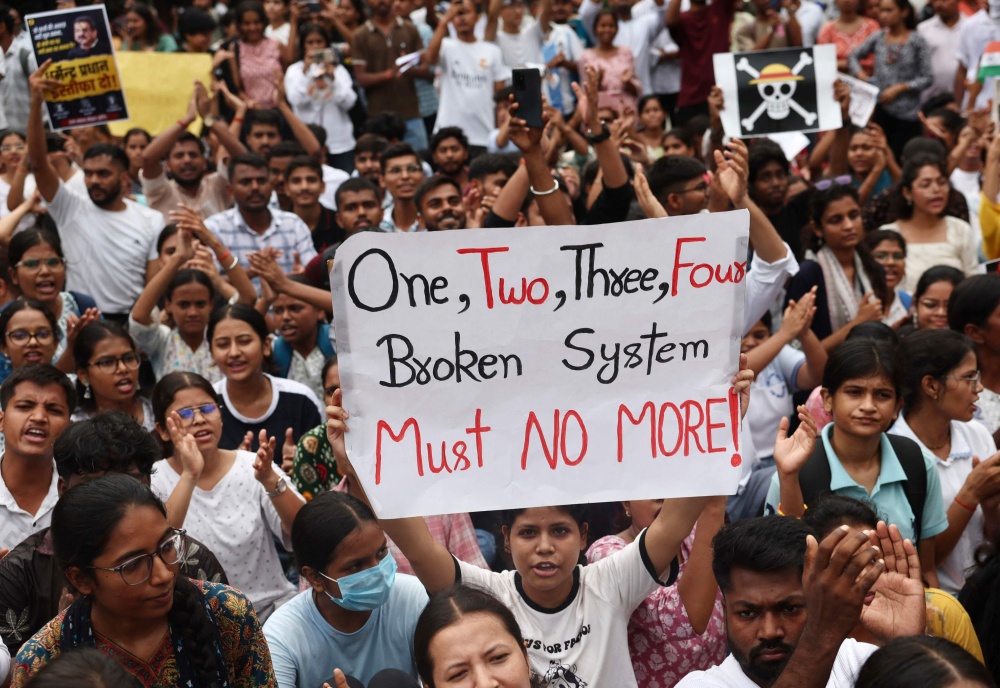 Banaras Hindu University students in solidarity with the Cockroach Janta Party hold placards during a protest demanding the resignation of India’s Education Minister Dharmendra Pradhan over alleged NEET examination irregularities in Varanasi on July 20, 2026. — AFP pic