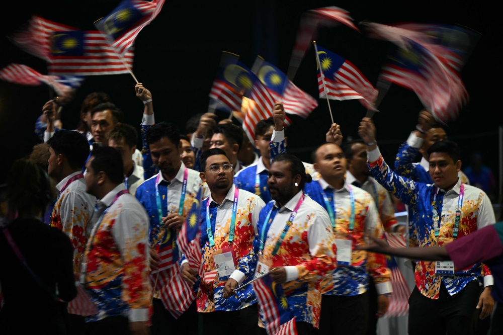 Athletes representing Malaysia arrive during the opening ceremony of the 23rd Commonwealth Games at the OVO Arena in Glasgow July 23, 2026. — AFP pic