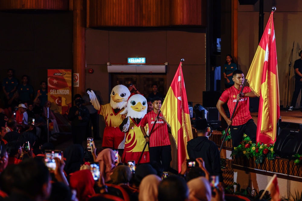 Selangor athletes parade the state flag during the flag handover ceremony for the Selangor contingent participating in the 2026 Malaysia Games (Sukma) and Para Sukma at the Sultan Abdul Aziz Silver Jubilee Hall Auditorium July 26, 2026. — Bernama pic