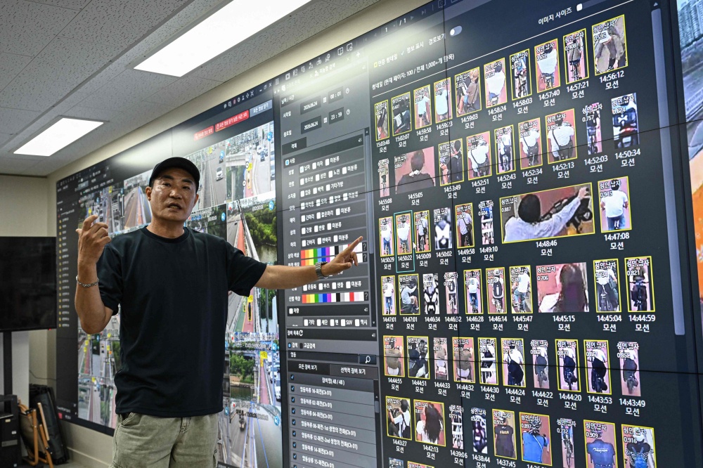 This photo taken on June 24, 2026 shows Kim Jun-young, chief of Hangang Bridge CCTV Integrated Control Centre, introducing the AI surveillance cameras during an interview with AFP in the control room in Seoul. The artificial intelligence-driven surveillance system alerts first responders if someone lingers in certain locations, enters an area deemed unsafe, or picks up one of the bridges’ dedicated suicide-prevention phones. — AFP pic