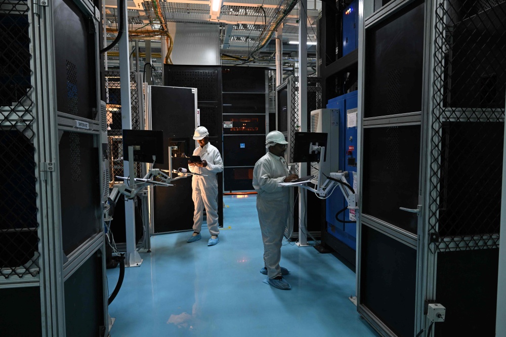 Employees monitor data on screens at Sterlite Technologies Limited (STL) manufacturing facility in Maharashtra’s Chhatrapati Sambhaji Nagar July 9, 2026. — AFP pic