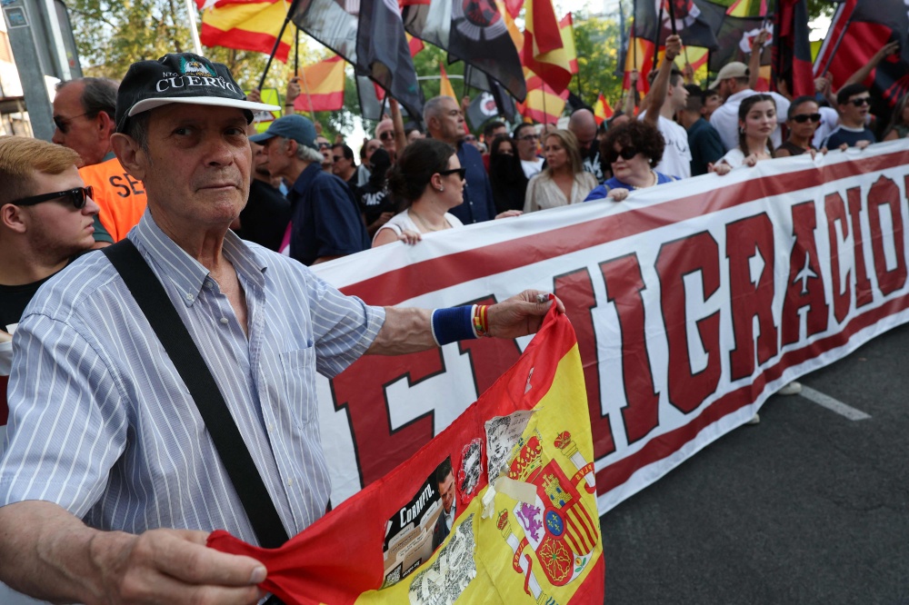 Far-right demonstrators protest against the mass arrival of Moroccan migrants in Ceuta, in Madrid on July 31, 2026. — AFP pic