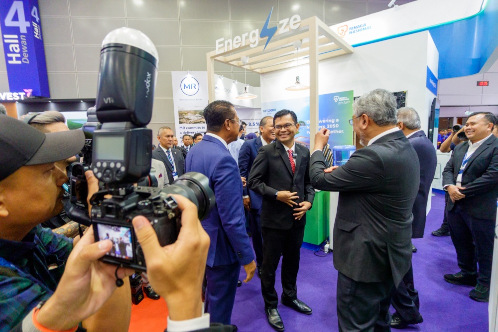Economy Minister Akmal Nasrullah Mohd Nasir (center) interacts with exhibitors while visiting the Tenaga Nasional Berhad (TNB) booth during the 7th International Sustainable Energy Summit (ISES) 2026. — Picture by Raymond Manuel