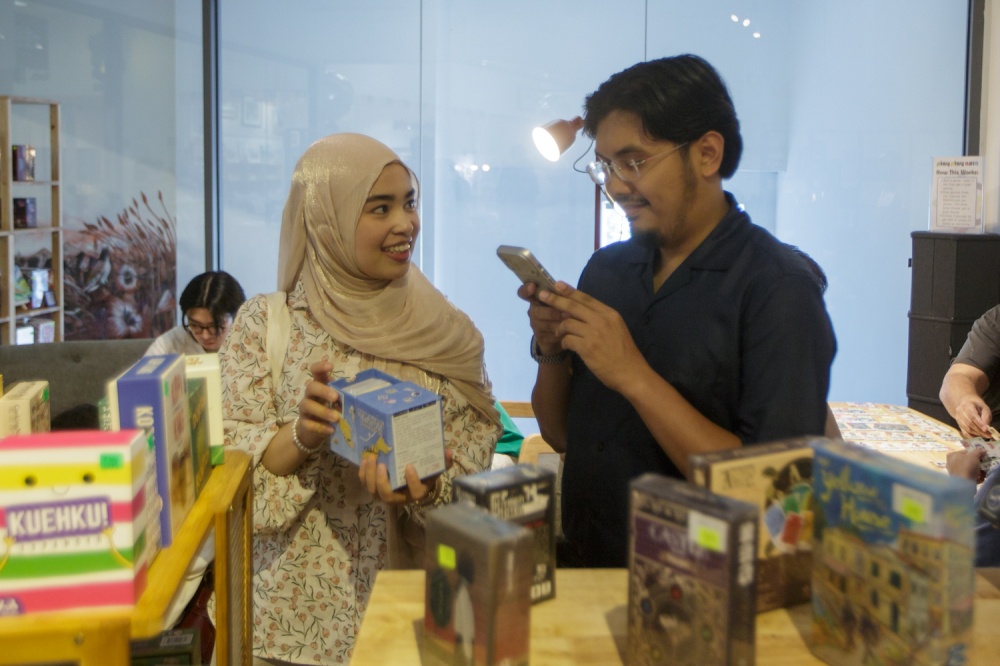 Two visitors take a stroll through the newly opened Play Play Asia store at GMBB. — Picture by Raymond Manuel