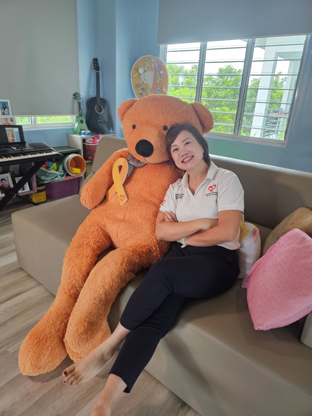 SCCS executive director Jodie Sim with Joseph, the bear. — The Borneo Post pic