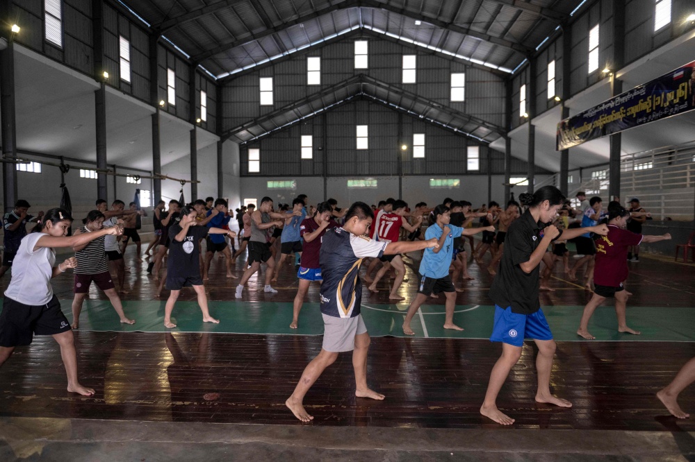 Fighters training in traditional Myanmar boxing known as Lethwei at a training camp in Hpa-an in Myanmar's Karen state. — AFP pic