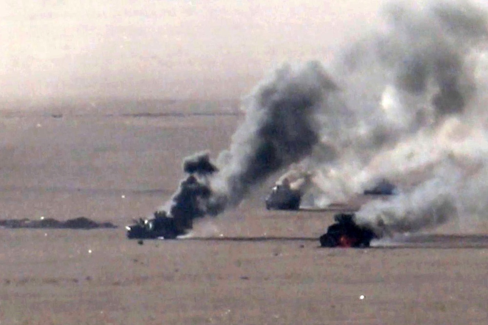 A handout picture released by Ansarullah Media Centre shows burning military vehicles targeted in al-Jawf on September 15, 2026. — AFP pic