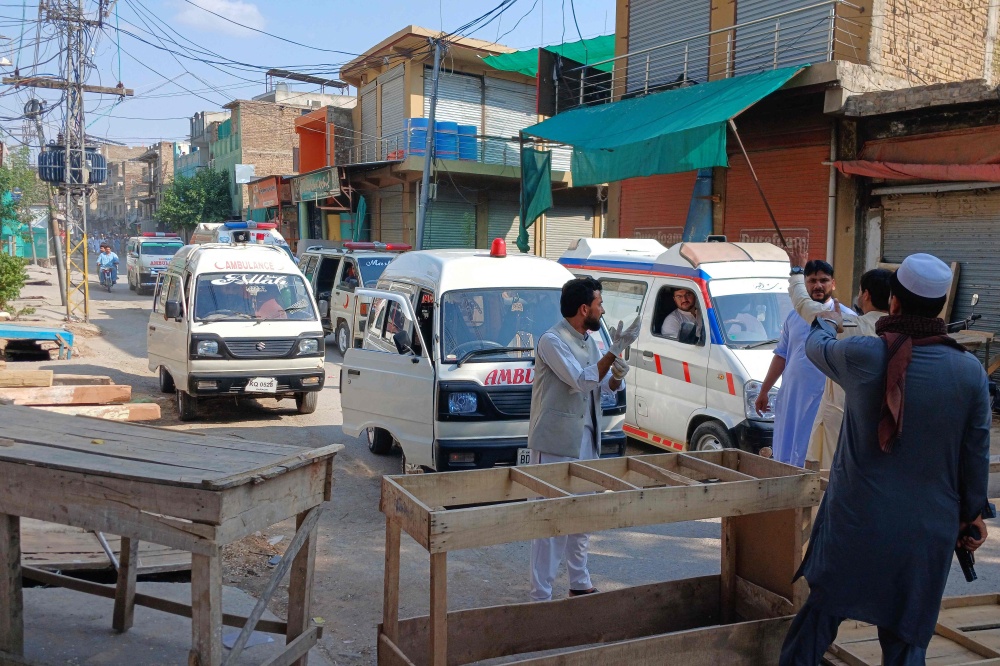 Ambulances gather near the police headquarters in Kohat, Pakistan’s Khyber Pakhtunkhwa province, on September 18, 2026, following a militant attack that killed at least 31 people and injured more than 100. — AFP pic