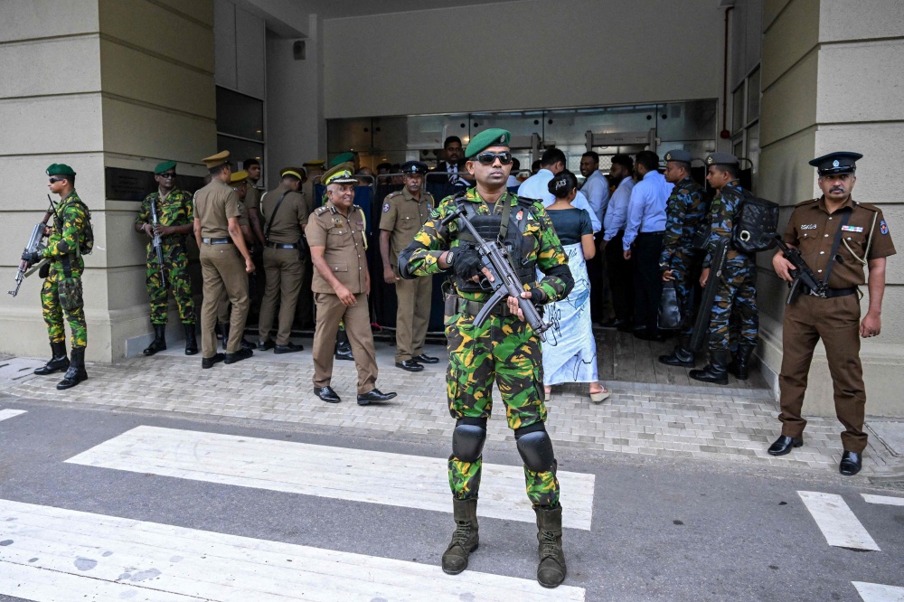 Security personnel stand guard outside Colombo High Court after escorting the accused involved in Sri Lanka’s Easter Sunday attacks of 2019, during the verdict in the trial in Colombo on September 22, 2026.