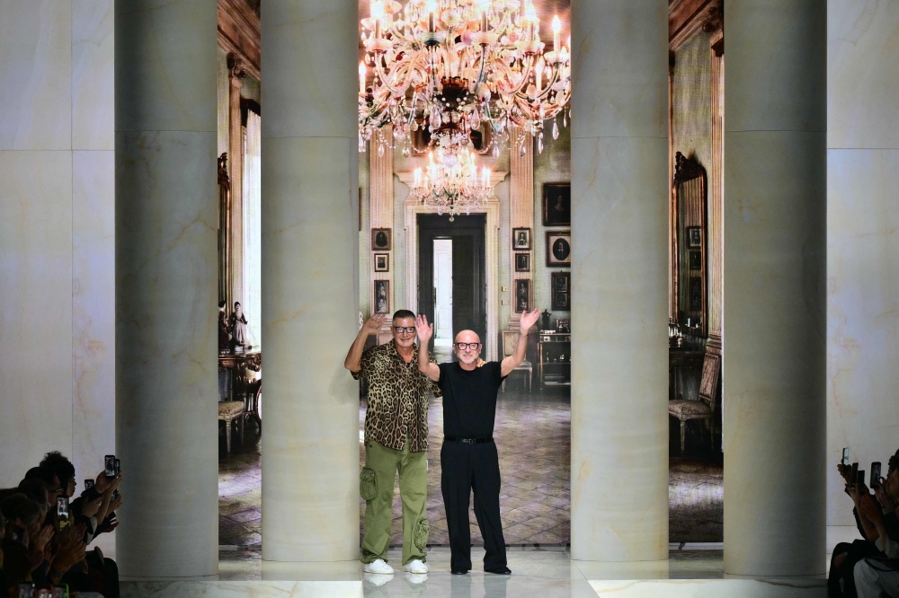 Italian designer Stefano Gabbana and Italian fashion designer Domenico Dolce greet the audience at the end of the Dolce & Gabbana collection show as part of Women’s Spring/Summer 2027 Milan’s fashion week September 26, 2026. — AFP pic