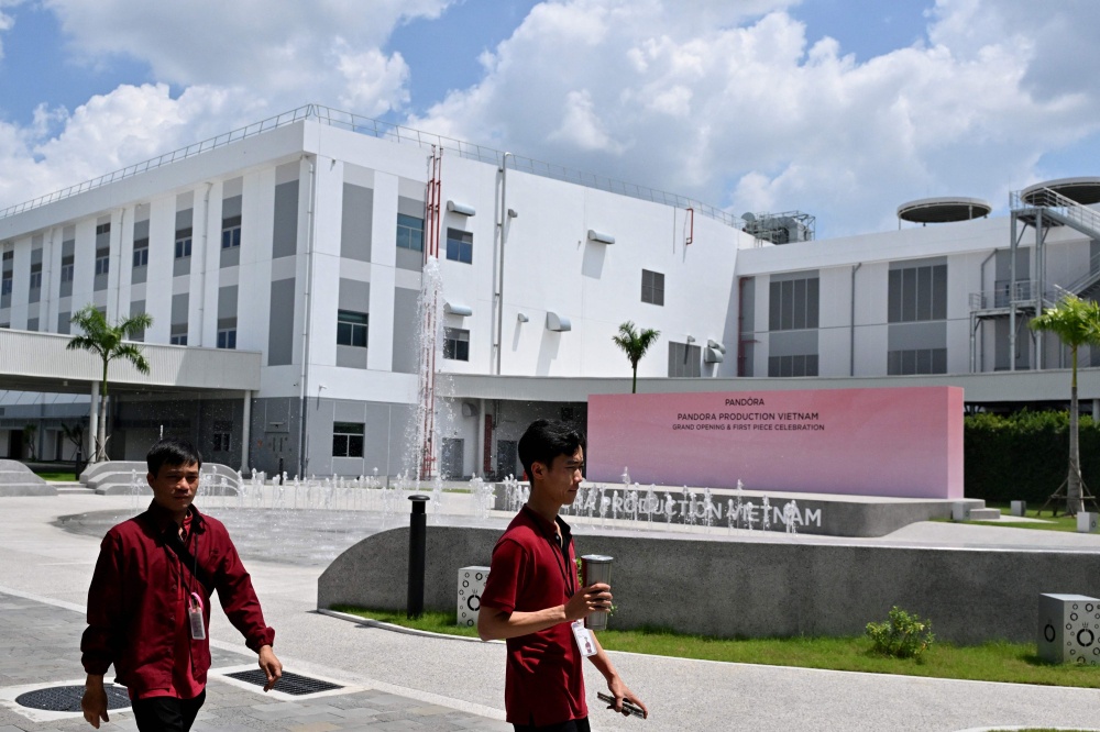Workers walk outside Pandora’s new manufacturing plant in Ho Chi Minh City on October 1, 2026, as the world’s biggest jewellery brand opened the facility it said will be able to produce up to 60 million pieces each year. — AFP pic