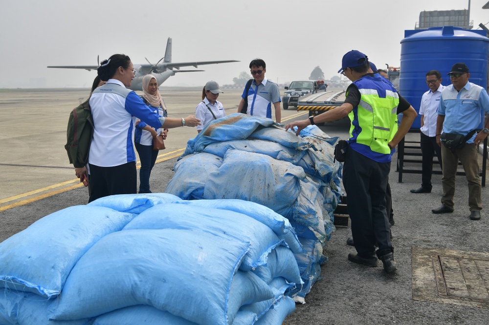 Preparation of solutions for cloud seeding operations at the Royal Malaysian Air Force (RMAF) Kuching Air Base in this file picture dated September 20, 2019. — Bernama pic