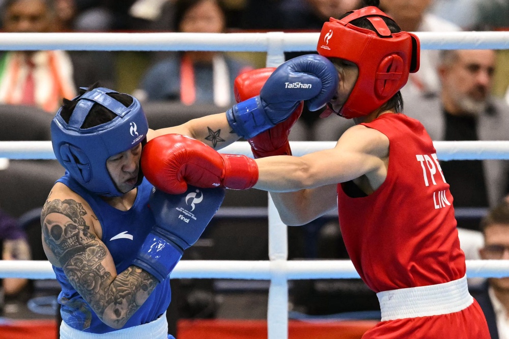 Taiwan’s Lin Yu-ting (red) competes against China’s Yang Chengyu in the women’s 60kg gold medal boxing bout during the 2026 Asian Games at Nishio Gymnasium in Nishio on October 2, 2026. — AFP pic