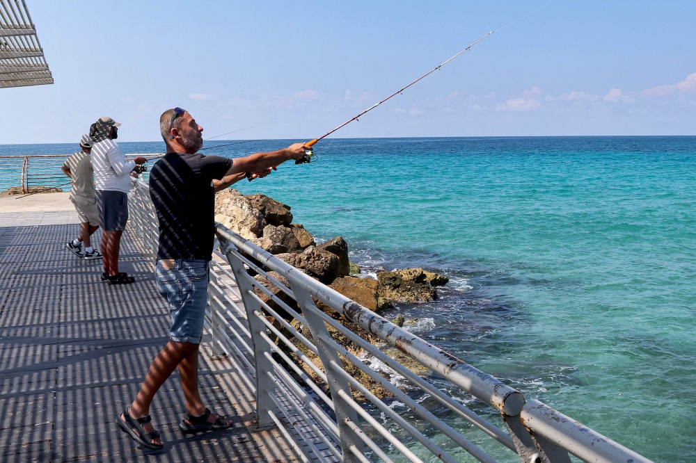 Maxim Zarbaylov, who was born in the former Soviet Union but has long lived in Nahariya, fishes in Nahariya, the northernmost Israeli town on the Mediterranean that will be facing its first election on October 27, 2026 since the 2023 war with Palestine. — AFP pic