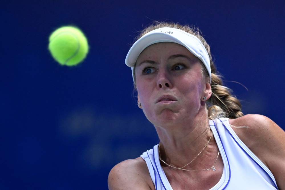 Poland’s Magdalena Frech hits a return to Poland’s Iga Swiatek during their women’s singles match at the Wuhan Open tennis tournament in Wuhan, China’s Hubei province October 14, 2026. — AFP pic