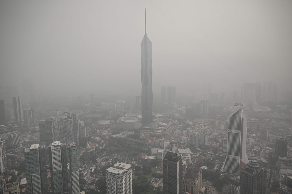 Buildings are shrouded in haze from Indonesian fires in Kuala Lumpur on October 16, 2026. — AFP pic