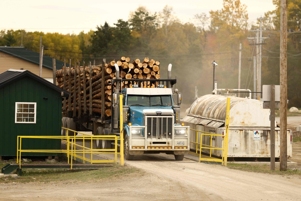 A truck carrying softwood lumber is weighted at the ‘Pleasant River Lumber’ sawmill in Enfield, Maine, on October 13, 2026. In the heat of US midterm elections, President Donald Trump’s tariffs on Canada, and Ottawa’s retaliation, have taken centrestage in timber-producing Maine, walloped by the economic fallout perhaps more than any other state. — AFP pic