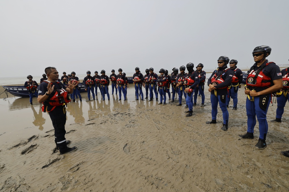 Rescue personnel participate in a disaster response exercise as part of preparations for the North-east Monsoon season. — Bernama pic 