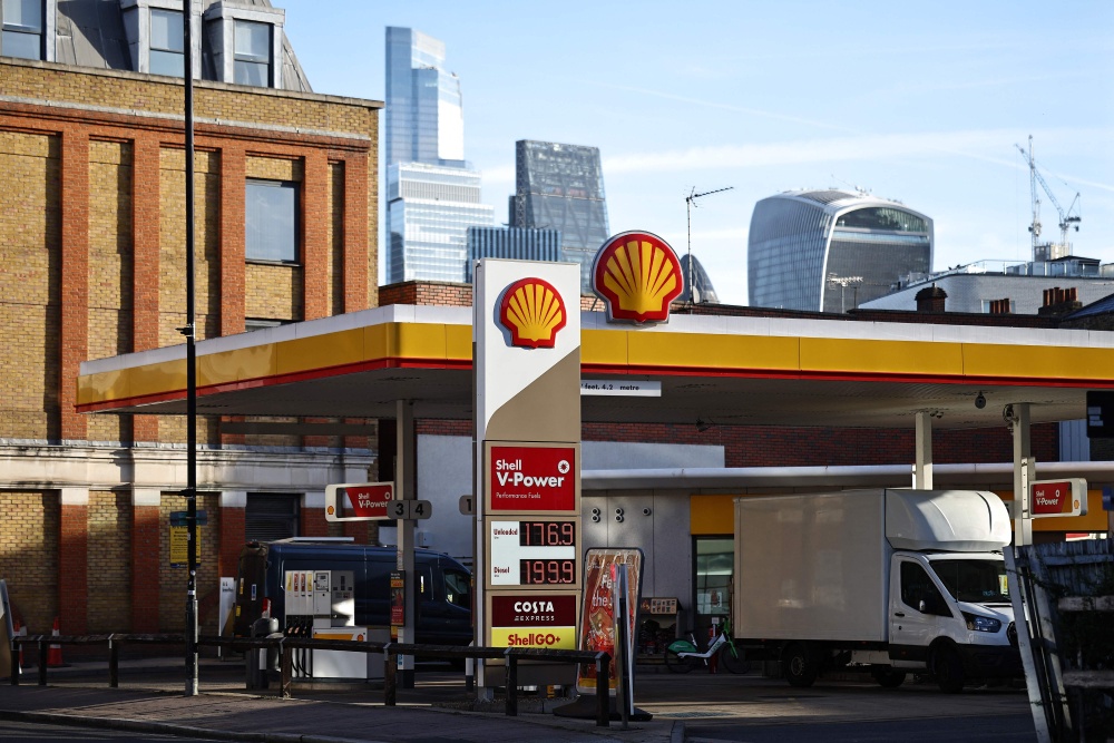 The price per litre of unleaded petrol and diesel fuels, with diesel at just under two GBP pounds sterling per litre, is displayed on sign outside a Shell petrol station in London October 2, 2026. Shell’s third quarter was boosted by record refining margins, which reflect the spread between the price of crude oil and the fuels derived from it. — AFP pic