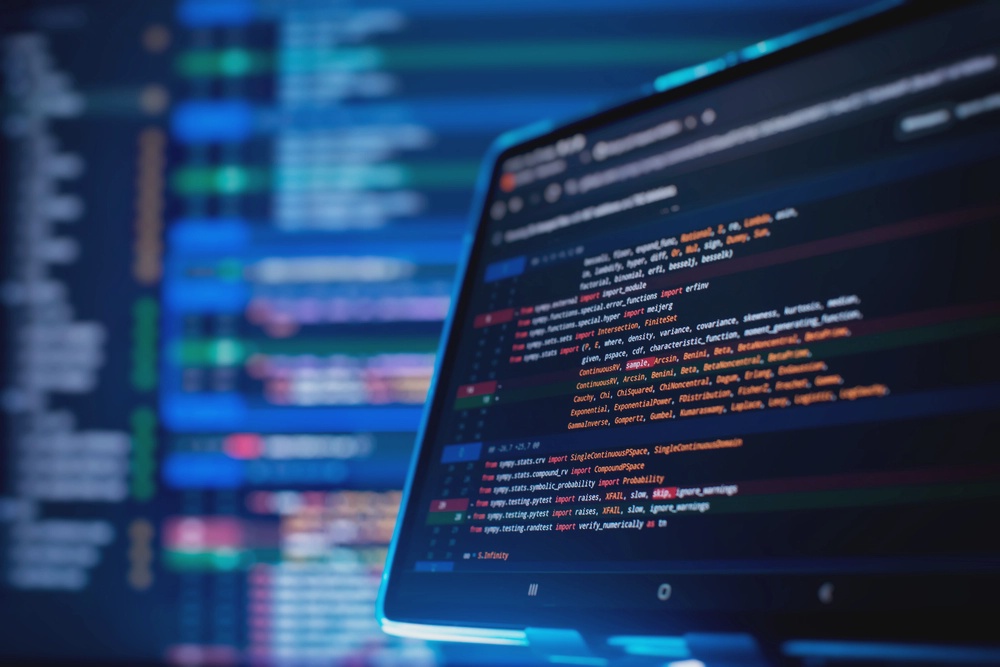 A laptop screen with a development environment using native coding.