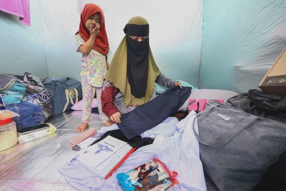 Image from: Kebakaran Sandakan: Tetap bersekolah biarpun berselipar, berpakaian biasa