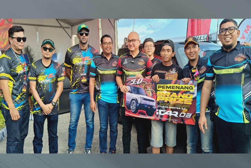 Image from: 'Tak sangka beli baju menang kenderaan EV bernilai RM130,000'
