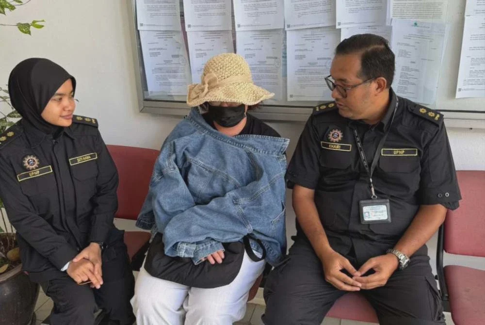 Image from: Ceroboh tanah kerajaan tanam durian, wanita didenda RM80,000