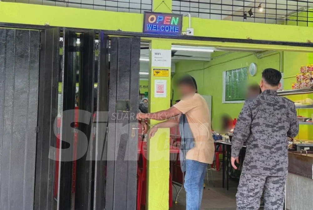 Image from: Sempat kemas restoran dengan tangan bergari sebelum diangkut Imigresen